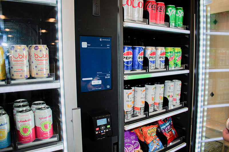 Smart Store door open to products like soda and snacks.