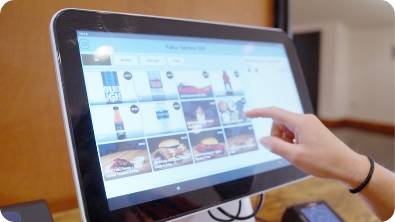 User scrolls through the menu screen of a kiosk.