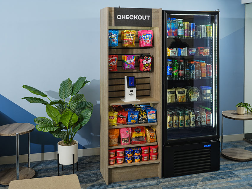 A Starter kiosk bundle featuring a 2' wide merchandiser with snacks and a cooler full of drinks.