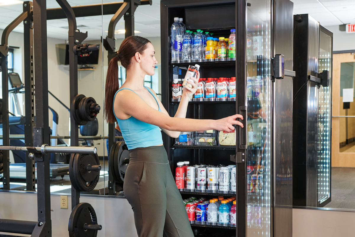 woman shopping at cooler in a gym