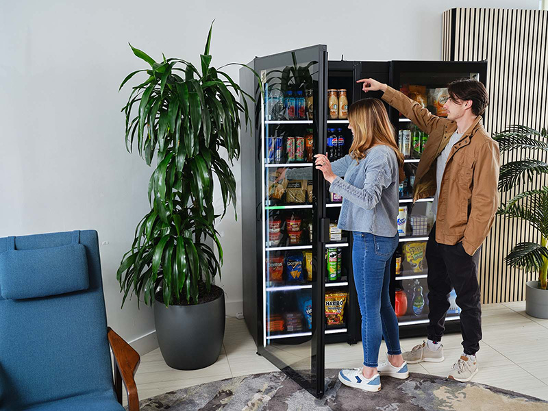 A woman and her son shop at a residential Smart Store.